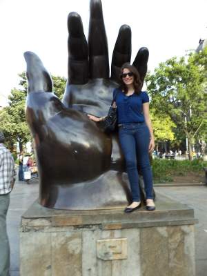 Nadine poses at Plaza Botero near Parque de Berrío.